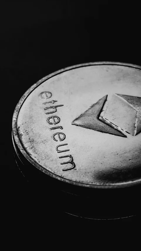 Ethereum commemorative coin on dark backdrop
