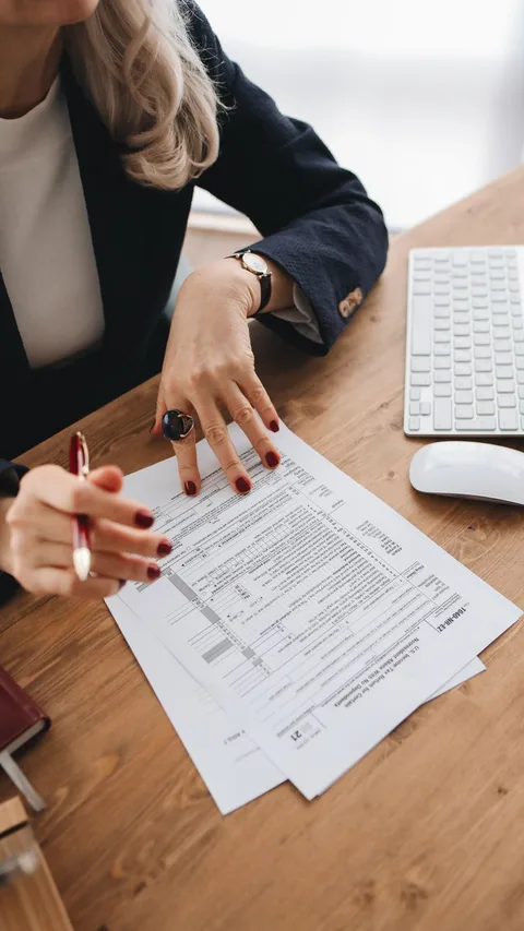 Printed legal statute documents on desk
