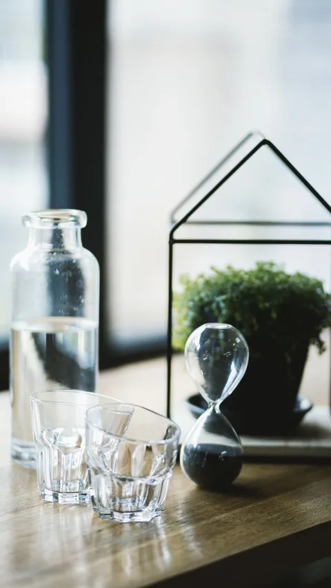 Glass hourglass with running sand