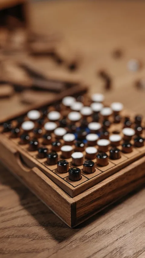 Colorful wooden pegboard game surface