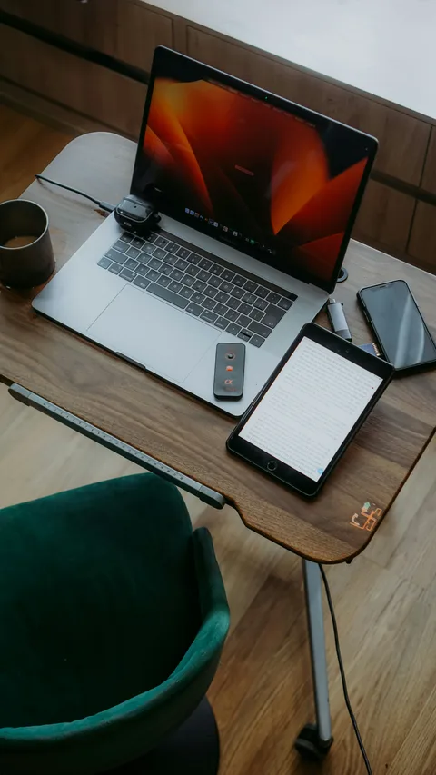 Smartphone standing on wooden desk